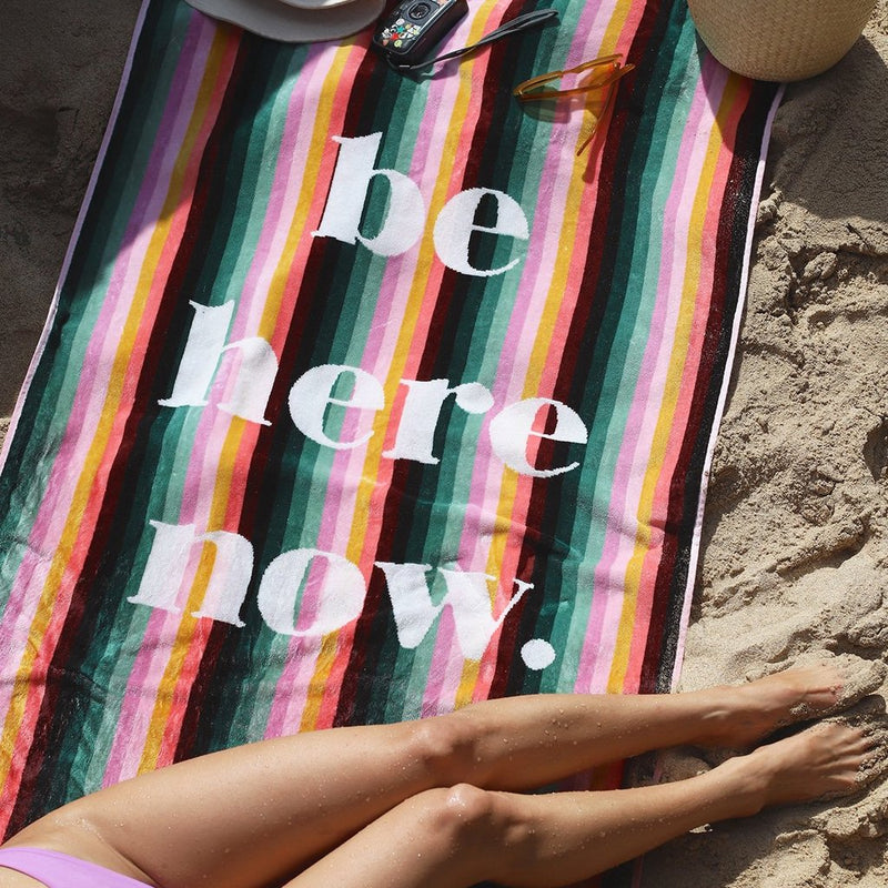 Be here now Beach Towel